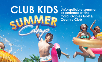 Kids in jumping in the air wearing inflatable tubes on sunny day
